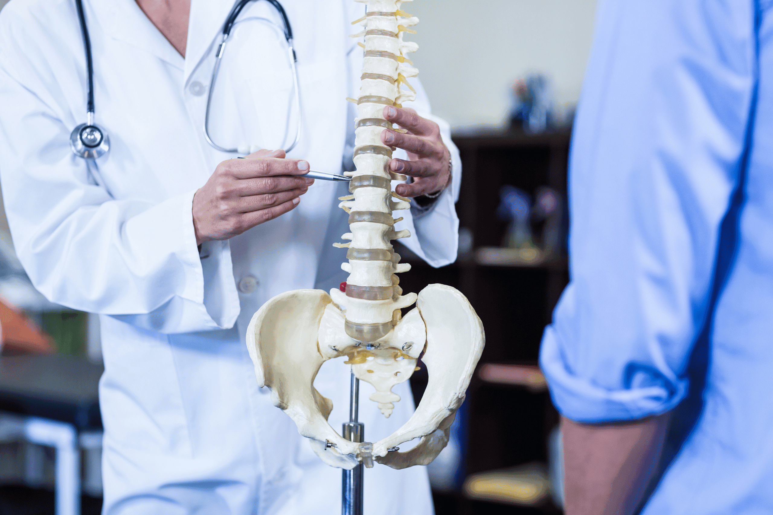 doctor explaining spine treatment in gurgaon